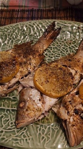 Baked wild caught snapper fish with lemon , butter and Italian Saasoning!