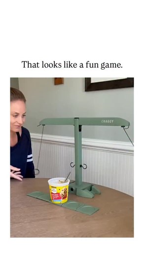 memefount on Instagram: "The post shares a 20-second video of a woman demonstrating "Hooks Ladder," a dexterity board game where players use hanging hooks to pull a ladder toward them without toppling a central yogurt cup, highlighting its tense, laughter-inducing gameplay. Posted on January 7, 2026, the video exploded to 2.5 million views and 11,000 likes within days, reflecting viral appeal of simple, portable party games amid rising interest in analog entertainment over digital screens. Threa