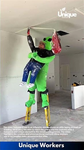 Alien Construction: Man Tapes Drywall Ceiling While Riding Inflatable Alien on Stilts