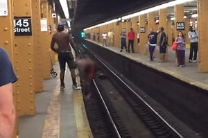 Epic fail as guy tries to jump subway tracks