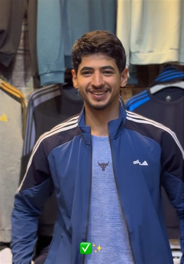 Stylish Black Adidas Tracksuit Outfits in Clothing Store