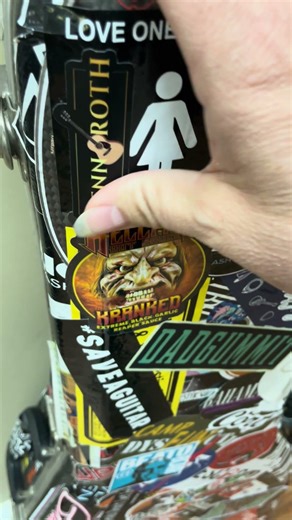 Adding a sticker to my guitar case!