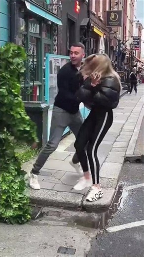 The Camo Dancer is giving 100% on the sidewalk today.