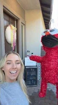 I hope Elmo doesn’t scare them 🎈💌🪅 #mailmen #minifridge surprising delivery drivers with a piñata