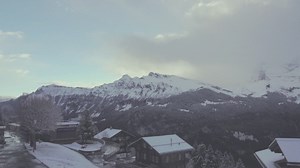 Snow-capped mountains and a small town - Free Stock Video