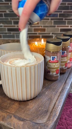 the perfect cozy night in: candles, a warm blanket, and an extra choclately hot cocoa ☕️ Find McCormick Choclate hazelnut at retailers nationwide | McCormick Spice
