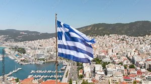 Greek Flag Waving on Tower Fortress of Kavala Old Town Greece, Aerial Slow Motion Video