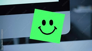 Smile character. Smile drawing on sticker on monitor. Message. Motivation. Reminder. Handwritten text written with a marker. Color sticker. A message for an employee, a colleague