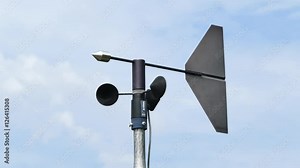 Anemometer measuring wind direction and wind speed at weather station.