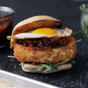 550K views · 4.5K reactions | A late night out calls for an entire deep-fried Camembert cheese wheel topped with bacon jam, a fried egg and, oh, arugula — for some greens. | Tastemade | Facebook