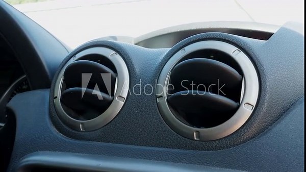 Adjusting and modifying air conditioner and fan in the car, closeup
