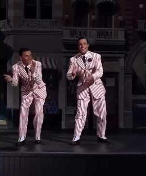 Gene Kelly and Frank Sinatra perform the title song “Take Me Out to the Ball Game” in the film T