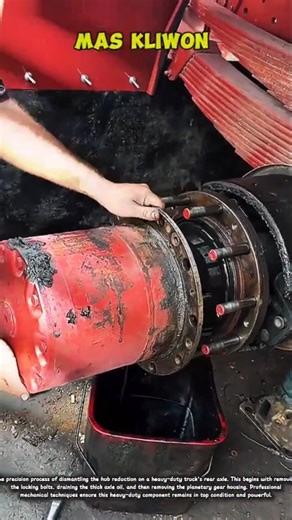 The precision process of dismantling the hub reduction on a heavy-duty truck's rear axle.