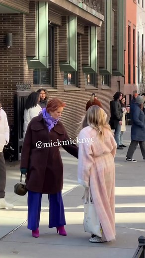 1.6M views · 10K reactions | Sarah Jessica Parker filming the an episode of “And Just Like That...” This was taken on February 2, 2023. As usual, the actress was wearing an unusual outfit: belted mohair robe, patterned cardigan, pink cowboy hat and T-shirt over sweatpants tucked into socks. She also carried a tote bag with the words ‘out getting ribs JM’ on, which appears to be a reference to artist Jean-Michel Basquiat.  | New York Mickey | Facebook