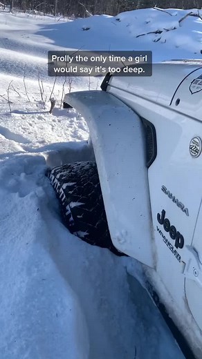 Blonde Girl Jeep in Snow Fun