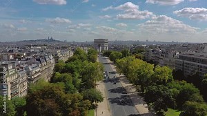 PARIS, FRANCE - OCTOBER 3, 2024: A stunning aerial view showcasing the Arc de Triomphe surrounded by lush trees and a clear blue sky