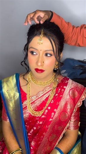Makeup Artist | Venisha Beauty | Beauty Salon on Instagram: "Minal ❣️ Maharashtrian bride Radiating grace, tradition, and timeless beauty ✨❤️ A classic red bridal look with royal gold touches, bold lips, and that perfect bridal glow 👰🏻‍♀️💫 Mua: @nehasahumua Bride: @minal._.28 Bridal makeup look, traditional Indian bride, red saree bridal look, Maharashtrian bridal makeup, bridal glow, HD makeup, wedding ready, bridal transformation, gold jewellery look, bridal hairstyle, mehendi vibes, Indian