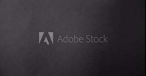 Dark texture for a gloomy background.. Black rough paper surface, slow moving. Use for background and texture.