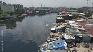Aerial of Slum Area along the polluted canal in Tondo Manila, Philippines