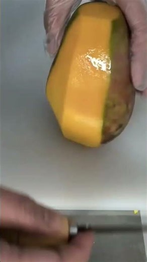 Peeling Sweet Mango Fruit Skin Manually Using Knife Tools