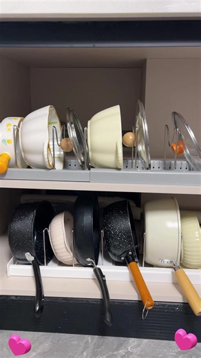 2. This adjustable kitchen storage rack will adjust to fit in any space and it's customizable to fit any size pot or pan! #kitchenstorage #kitchenstoragehacks #kitchenstoragerack #kitchenorganization #kitchenorganizer