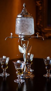 5.7K views · 89 reactions | Our traditional absinthe experience includes tableside service with an ice water drip and a sugar cube over a glass of the green spirit. This process mixes, sweetens, and dilutes the absinthe, making for an eye-catching and delicious cocktail experience. The Pfister Hotel | Lobby Lounge Ask one of our bartenders the next time you stop in! | The Pfister Hotel | Facebook