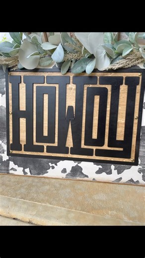 I used a Mylar stencil to paint the cow pattern all over the back of the 36” board. Next I used my glowforge to cut out the rectangle piece. I scored the word howdy on it, so placing the 3D cutouts would be easier. I used wood glue to attach all of this to the sign. The tacks just help make sure all the corners of the basswood lay flat, sometimes pieces like this need some extra security! For the finishing touches I added some garland to the top! I have the SVG available and this sign for sale o