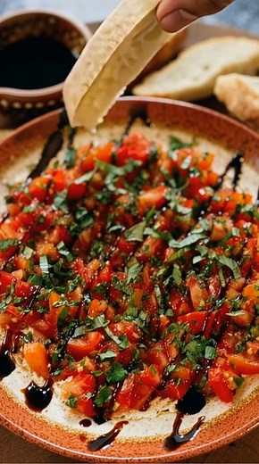 Bruschetta Dip Ingredients: • 8 oz cream cheese, softened • 1/2 cup sour cream • 1/4 cup fresh basil, chopped • 1 garlic clove, minced • 1 cup cherry tomatoes, diced • 2 tablespoons balsamic glaze • Salt and pepper to taste • Pita chips or baguette slices for serving Directions: 1. In a bowl, mix the softened cream cheese, sour cream, chopped basil, minced garlic, salt, and pepper until smooth. 2. Spread the mixture into a serving dish. 3. Top with diced cherry tomatoes and drizzle with balsamic
