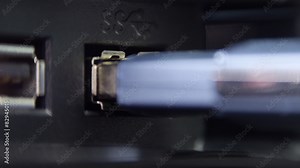 Inserting usb flash drive into computer and pull out.