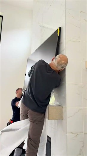 75” Frame TV installation on tile with a flush mount and hidden wiring. Perfect for modern interior