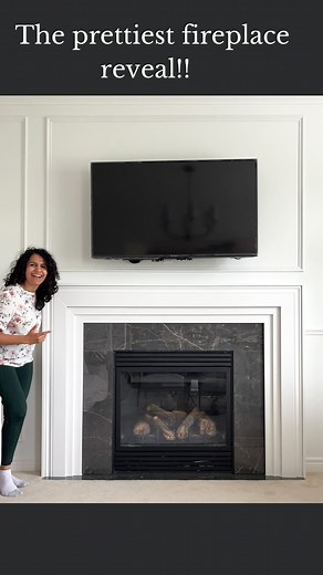 Hana | DIY & Home Design on Instagram: "STUNNING modern fireplace reveal 😍🥰 This fireplace tested my math skills and patience. Remember how nervous I was to remove the old one? I think I did WAY better, don’t you??? And the best part - I made this from baseboard trim! 🤯🤯 This is the first project I’ve hired out (for the tiling). As a DIYer, I want to be good at it all, but I could not risk my mom disliking her living room 😅😵‍💫 I put my pride aside and I don’t regret it one bit!! Full tuto