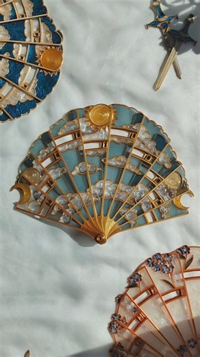 Mad Mad Raven on Instagram: "✨ 𝐒𝐮𝐧 ✨ I miss you more and more! ☀️ That's probably why I made more Sun and Moon hand fans than any other design for this Fridays restock I don't think anybody will mind 🥰☀️ #handfan #sunandmoon #whimsicalaesthetic #epoxyart #3dprint"