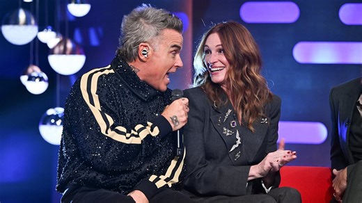 Robbie makes Julia blush over her baking skills during live performance