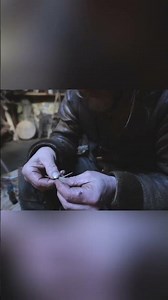 Stitching a leather sheath for a flint dagger, using deer sinew and bone needle