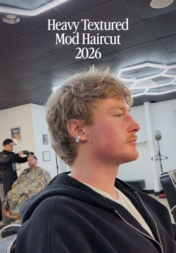 Heavy texture. Clean lines. Modern silhouette. This mod cut is all about strategic layering—removing weight where it counts and building movement through the crown and fringe. The texture isn’t random; it’s sculpted to work with natural growth patterns and hair density. I’m calling it now—this is going to be the go-to cut for 2026. If you want to stay ahead instead of chasing trends six months late, this is where we start. If your hair feels heavy, grows awkward, or you’ve been told “it just doe