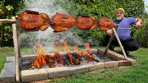 Duck roasted over open flame with crispy golden skin