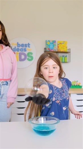 BOUNCING BUBBLES 🫧 You have to give this a try! Make bubbles bounce this summer ☀️ We thought this was so much fun! Here’s what you need: 1 cup Warm Water 💧 1/4 cup of Dawn Dish Soap, 1/4 cup regular sugar. Mix all of the ingredients together, let sit overnight. Next day, blow the bubbles and use your hand to try to “catch” and bounce the bubbles on the hand with the glove. You can also use your sleeve but we found a glove was easier and worked better. Tips: You may need to try it a few times 