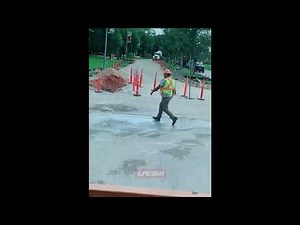 Construction worker rushes out to porta potty