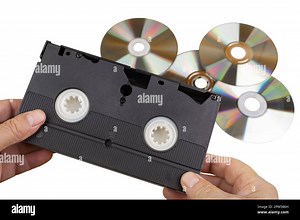 An old VHS videotape and some CDs Stock Photo - Alamy