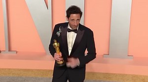 Oscars' red carpet features sculptural and shiny gowns and some props