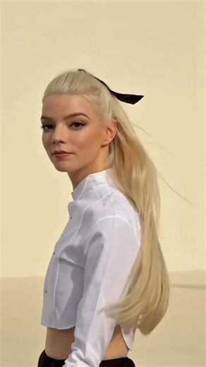 HAREM’s Couture on Instagram: "Following the Dior Spring/Summer 2026 show at Paris Fashion Week, Anya Taylor-Joy emerged in a look that distilled the house’s codes into a modern gesture of restraint and precision. ❤️‍🔥🤍 Her white cropped blouse, sharply tailored and collar-framed, paired with a voluminous black skirt, offered a monochrome study in proportion and poise. With platinum hair slicked back and heels that echoed the silhouette’s discipline, she embodied the kind of quiet authority th