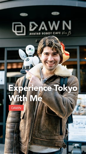 Tokyo Tokyo on Instagram: "Exploring a futuristic café experience that connects people with Foxmask (@foxmaskdaze) ☕ Located in Nihonbashi, BUNSHIN Robot Cafe DAWN ver.β is an avatar robot café where robots serve guests in a truly futuristic setting 🤖 Each robot is remotely operated by a “pilot”, people who may find it difficult to go out, creating warm, human connections at every table through technology. The café also offers guided walks around the Nihonbashi area through a robot that joins y