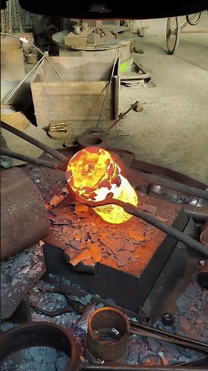 Super satisfying! Up-close footage of the forging process.