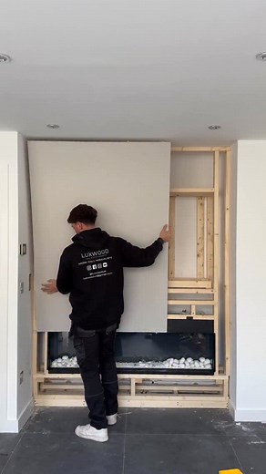 Sleek, stylish, and built to wow. Our latest chimney-style media wall bringing warmth design to this open-plan kitchen. #MediaWall #ChimneyStyleMediaWall #OpenPlanLiving #HomeDesign #InteriorInspo #KitchenDesign #FireplaceWall #ModernInteriors #HomeRenovation | Luxwooduk