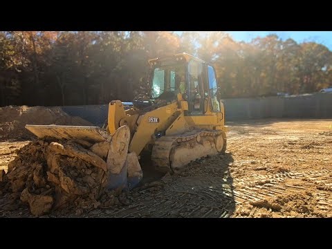 Grading a pond with a Cat 953k track loader