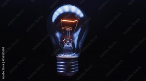 Electric tungsten lamp flashes on a black background. The element is looped