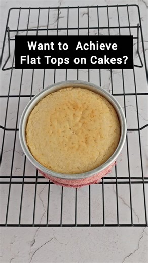 Sugandha | Baking Instructor | Cake Artist on Instagram: "Here’s how I get a Perfect Flat cake top😍 ✅Save this reel for later 🔥 Baking Strips/ Cake Strips- You get these in the market. If you can’t find them, simply cut strips from an old towel. Soak them in water and squeeze to remove excess. Tie Damp towels around Cake pan and bake. 🔥 These insulates the pan sides, allowing the edges more time to rise resulting in flat, even layers♥️ ‼️Other Things to Consider - Bake at a lower temperature 