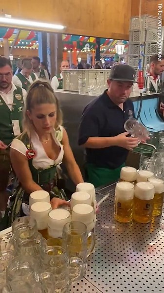 Oktoberfest waitress carries 13 beers