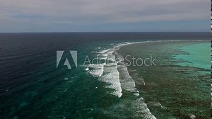 Ocean aerial view drone. Vitality of blue energy and clear ocean water. sea waves in top-down drone shot perspective. Crashing wave line in Open Atlantic sea with foamy white texture.