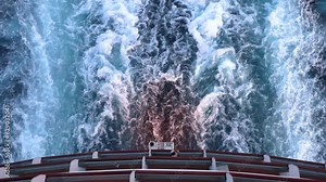 Mega Giant Cruise Ship sailing and leaving Ship's wake as it sails